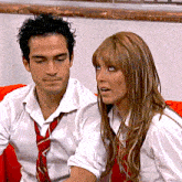 a man and a woman are sitting next to each other with the words colucciyarango on the bottom right