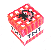 a cube made out of beads with the word tnt on it