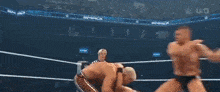 a man in a wrestling ring with the word general on his trunks