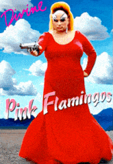 a poster for divine pink flamingos shows a woman in a long red dress holding a gun