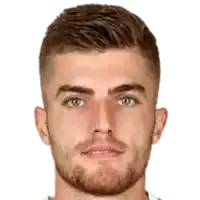 a close up of a man 's face with a beard and blue eyes