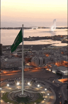 an aerial view of a city with a flag that says ' saudi arabia ' on it