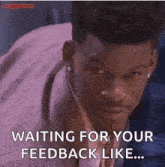 a man in a suit and tie is waiting for his feedback like .