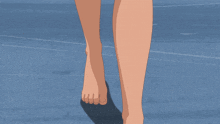 a woman 's bare feet are shown on a blue background