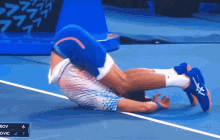 Novak Djokovic Back Stretch GIF - Novak Djokovic Back Stretch Somersault GIFs