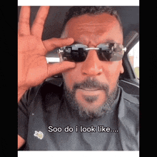 a man with a beard wearing sunglasses says soo do i look like ...