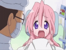 a little girl with pink hair is being examined by a doctor