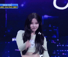 a woman in a green crop top is dancing on a stage that says special stage