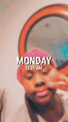 a blurred image of a person with the words monday 11:21 am