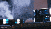 a couple of boxes are sitting on a table with smoke coming out of the boxes .