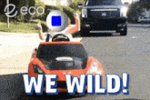 a red toy car with the words we wild on the bottom
