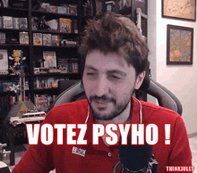 a man in a red shirt with the words votez psycho on it