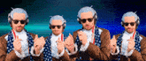 four men wearing sunglasses and headphones are dancing