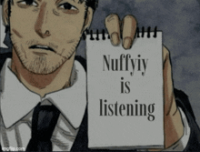 a man in a suit holds up a notepad that says nuffyiy is listening