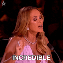 a woman speaking into a microphone with the word incredible written below her