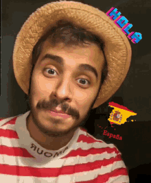 a man wearing a straw hat and a red and white striped shirt says hola