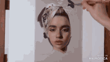 a painting of a woman with a scarf around her head is being made in animatica