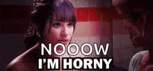 a woman is looking at herself in the mirror and saying `` nooow i 'm horny ''