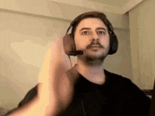 a man wearing headphones with a microphone on his head