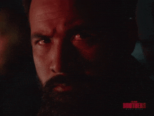 a close up of a man 's face with the words blood brothers written on the bottom