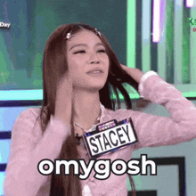 a woman with a name tag that says stacey on it