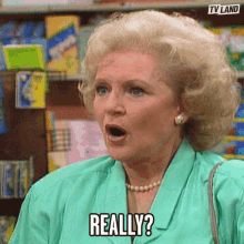 a woman in a green jacket is making a funny face and saying really .