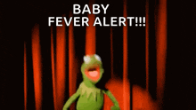 kermit the frog is dancing in front of a red curtain and says baby fever alert .