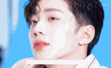a close up of a person 's face with a blue background and the word peepeep on the bottom right