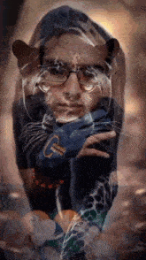 a man with glasses and a cat on his face is wearing a blue shirt that says ' u.s. army '