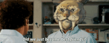 a man with a cat mask on his face is talking to another man with the words did we just become best friends
