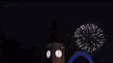 a clock tower surrounded by fireworks with the numbers 1 through 12 on it