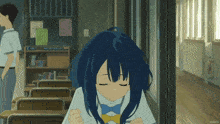 a girl with blue hair is sitting at a desk in a hallway with a man standing behind her