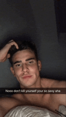 a man is laying in bed with a caption that says nooo don t kill yourself your so sexy aha