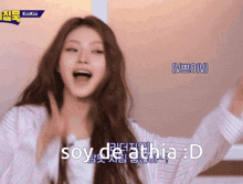 a woman with her mouth open and the words soy de athia : d