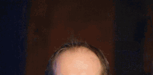 a close up of a man 's face with a beard