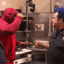 a man in a red hoodie stands next to a man with blue hair in front of a wall that says bar rescue