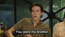 a man says " you were my brother " in front of a camera