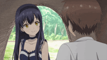 a boy and a girl are in a tent and the girl is smiling