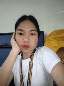 a girl with a lanyard around her neck that says ' i 'm a filipina ' on it