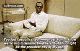 a man is sitting on a couch with a quote from a movie on it .
