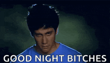 a man in a blue shirt is smiling and says good night bitches .