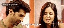 a man and a woman are talking to each other and the woman is crying .