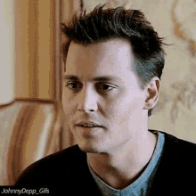 a close up of a man 's face with the caption johnnydepp_gifs on the bottom