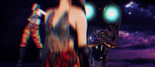 a woman in a colorful dress is standing in front of a monster