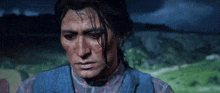a close up of a man 's face with a tear coming out of his eye