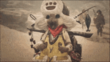 a cat wearing a hat and a vest with the letter y on it is holding a fishing rod