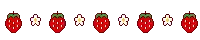 a row of strawberries with green stems and leaves