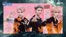 three young men are standing in front of a screen that says mnet