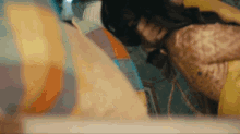 a close up of a person laying on a bed