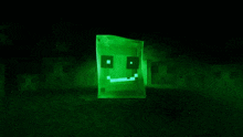 a close up of a green light on a black background .